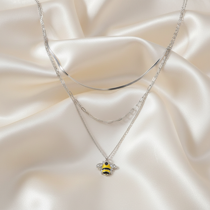 Stone Enamel Bee Triple Layer Necklace on luxe cream satin drape