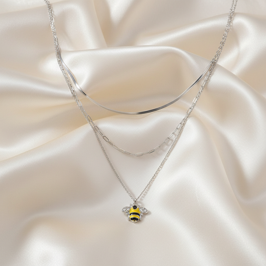 Stone Enamel Bee Triple Layer Necklace on luxe cream satin drape